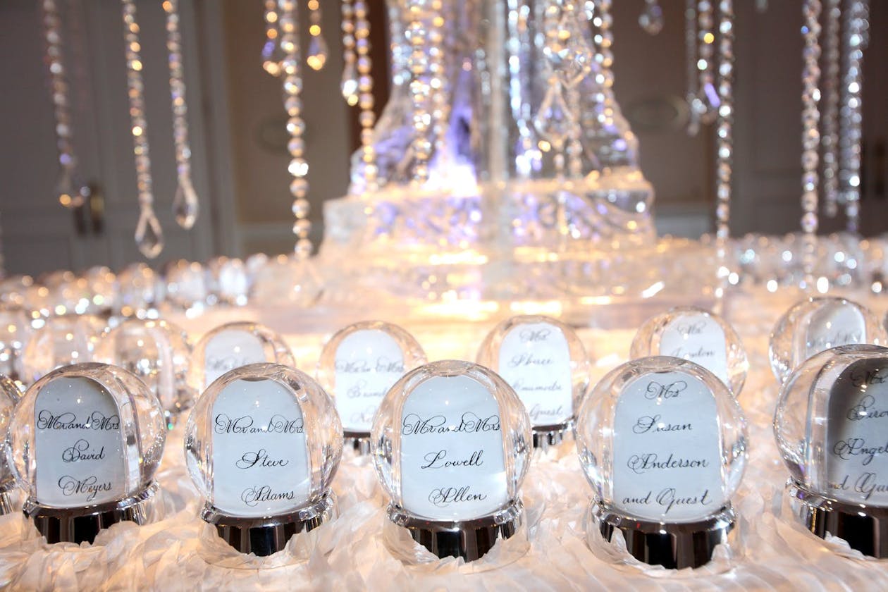 snow globe place cars and party favors for winter wedding | PartySlate