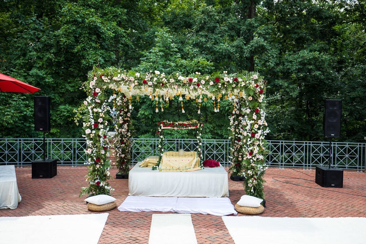Sikh wedding mandap with greenery | PartySlate
