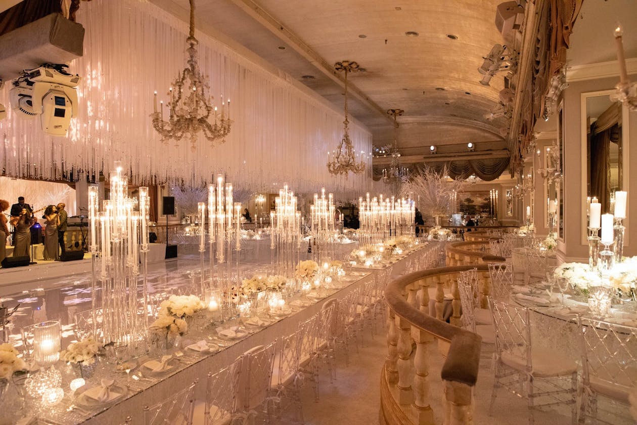 White winter wedding reception with candlelit tablescapes | PartySlate
