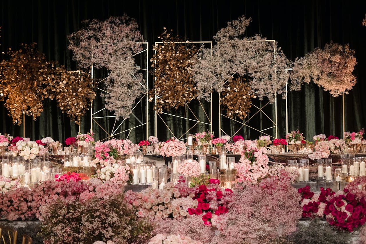 Indian wedding feast with lavish baby's breath and pink floral décor | PartySlate