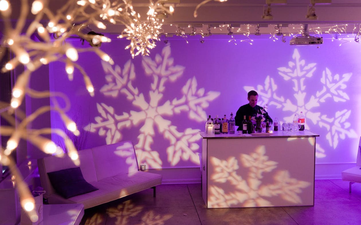 Wedding bar with purple LED lighting and snowflake projection | PartySlate