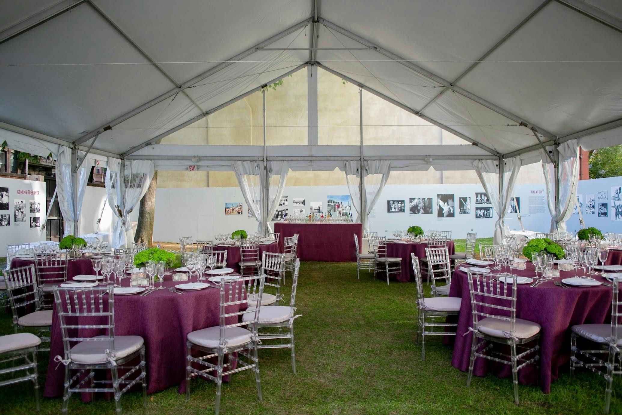 Tented dining area with purple tablescapes at New-York Historical Society | PartySlate