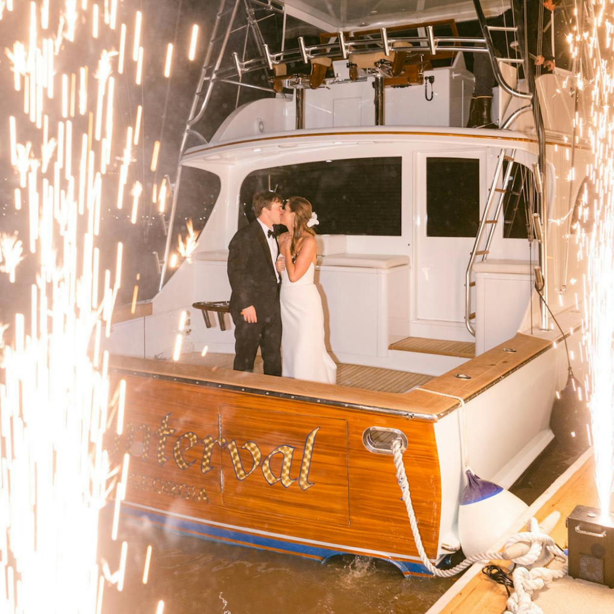 Lavish Wedding at The Westin Savannah Harbor Golf Resort and Spa in Savannah, Georgia With Creative Wedding Exit And Couple Leaving On A Boat With Sparklers | PartySlate