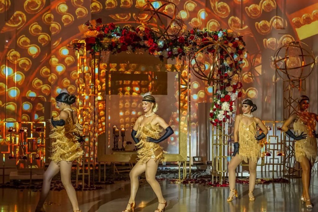 Great Gatsby Party Theme with flapper dancers in gold | PartySlate