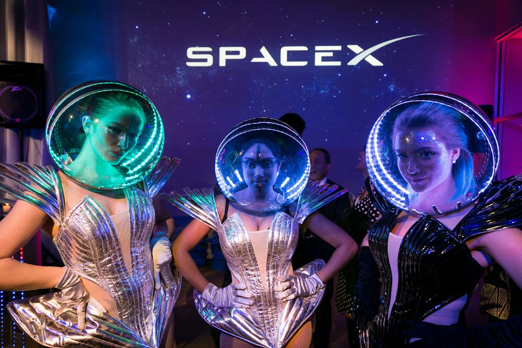 Three women in space suits at space theme party at Carnegie Library | PartySlate