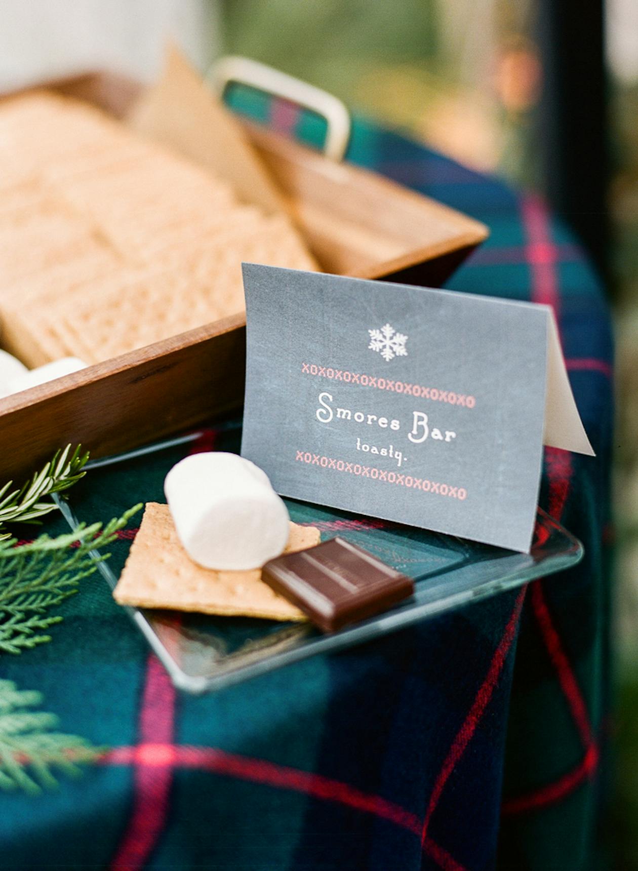 Apres-Ski Holiday Party at Private Residence A smores bar sign with a smore | PartySlate