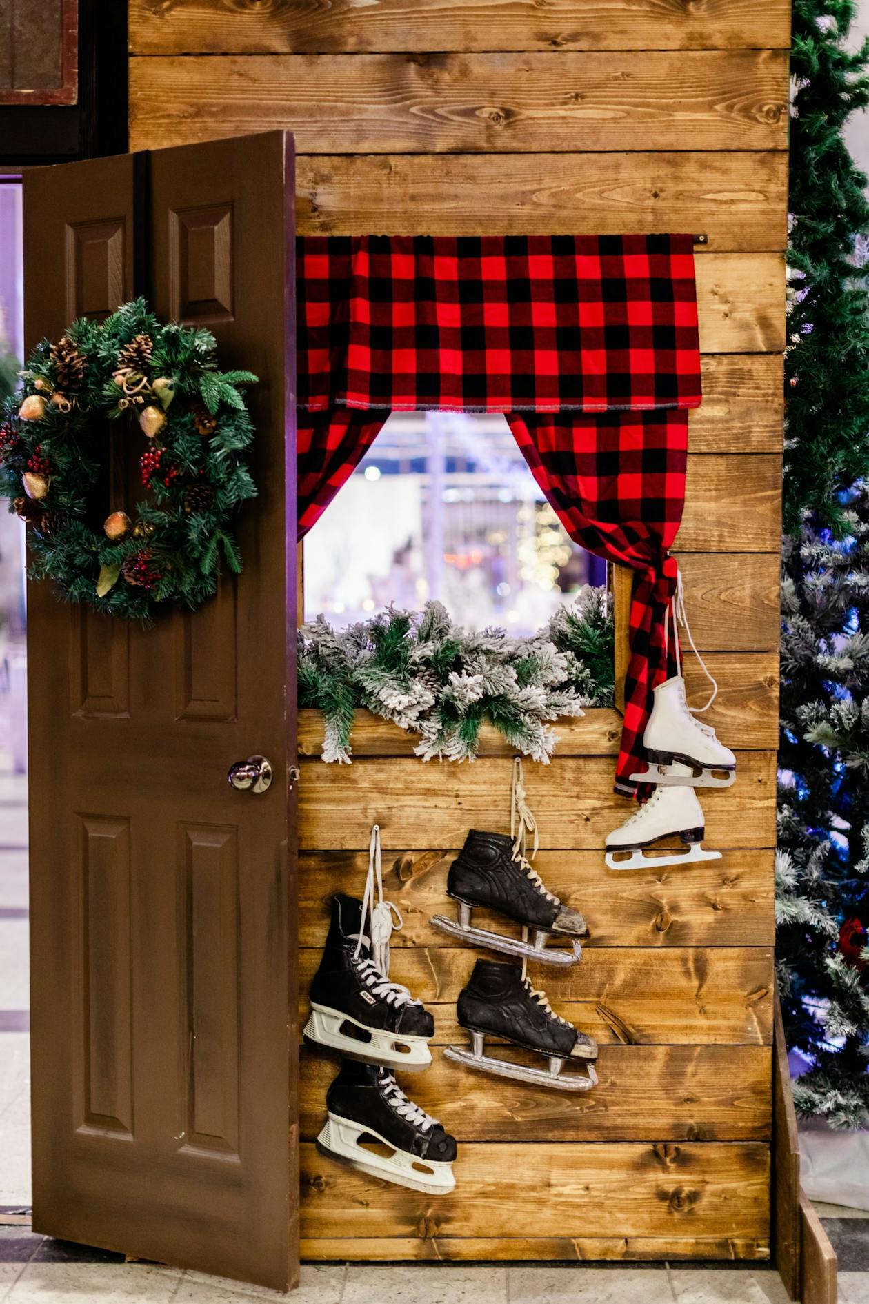 A wall with ice skates hung up on it and a cabin home design | PartySlate