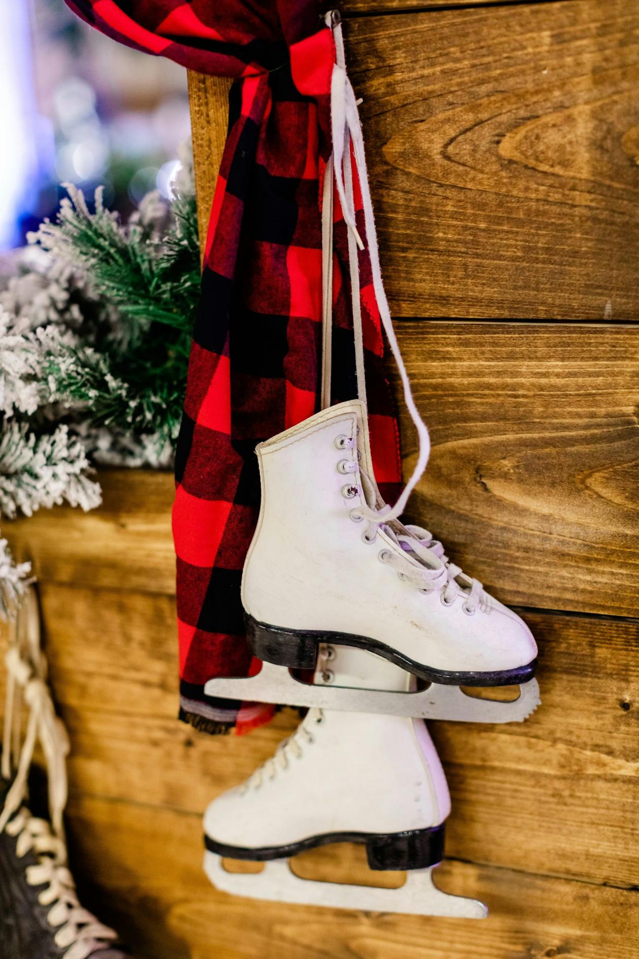 A wall with ice skates hung up on it and a cabin home design | PartySlate