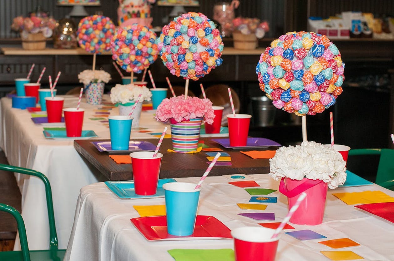 Candy shop-themed party with lollipop centerpieces | PartySlate