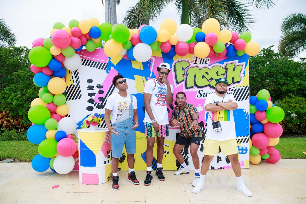 80s theme Fresh Prince of Bel-Air Party with colorful balloon backdrop | PartySlate