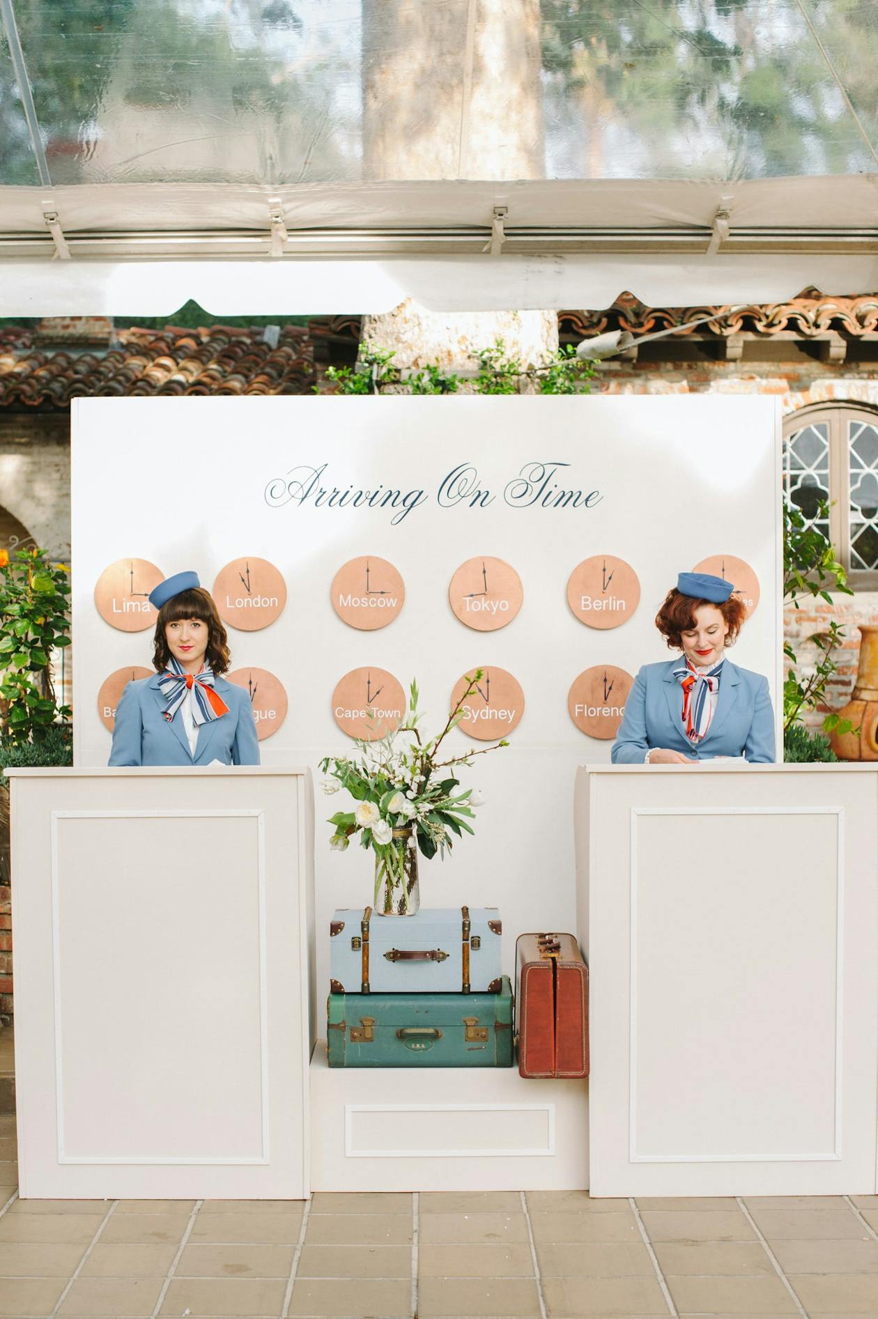 Travel Themed Wedding With Pastel Colors and Airport Gate Agents | PartySlate