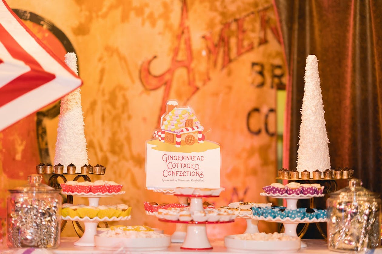 Gingerbread Cottage Confections dessert bar at Candy Land corporate event | PartySlate