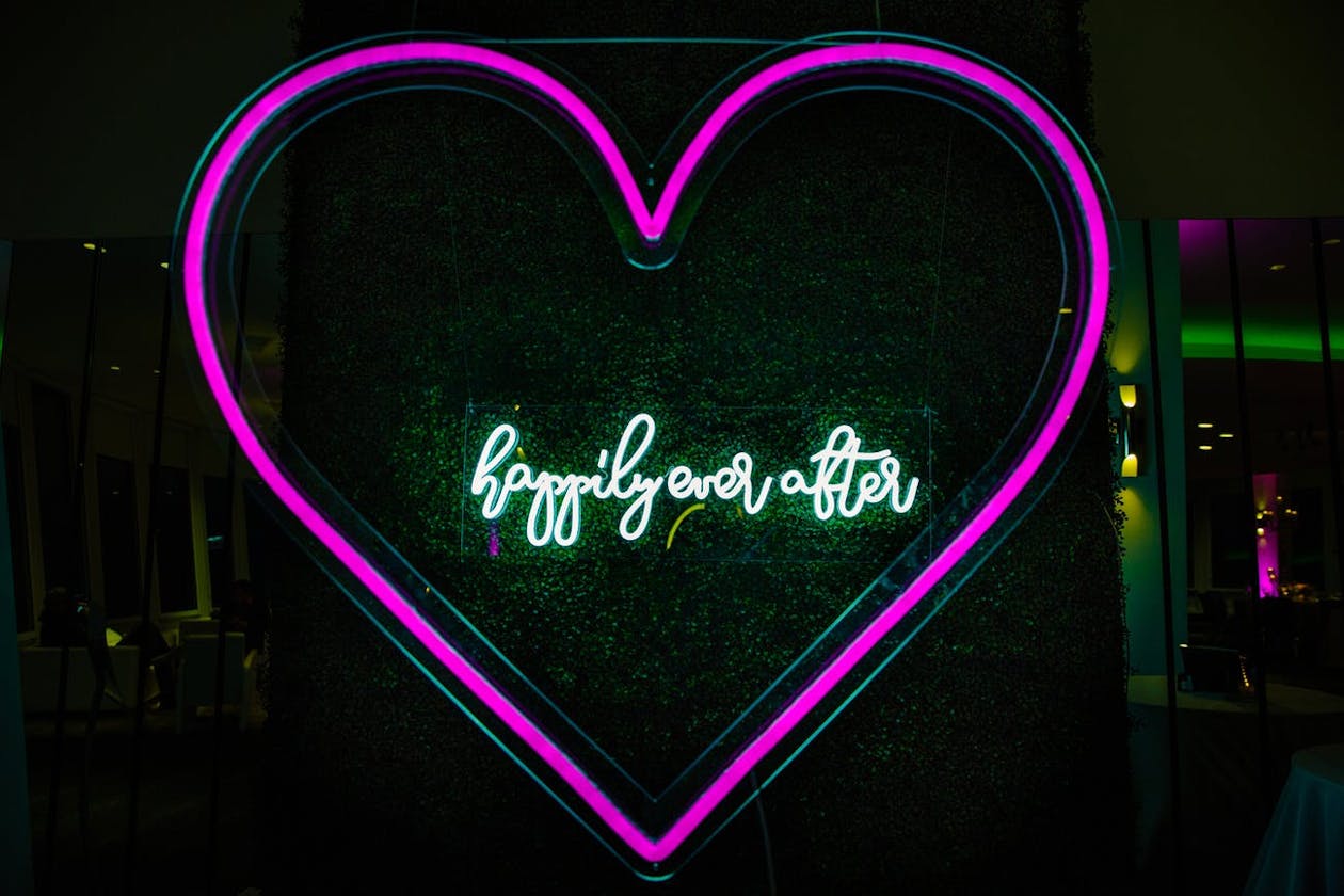 Neon Wedding Sign with Happily Ever After Greenery and Pink Heart | PartySlate