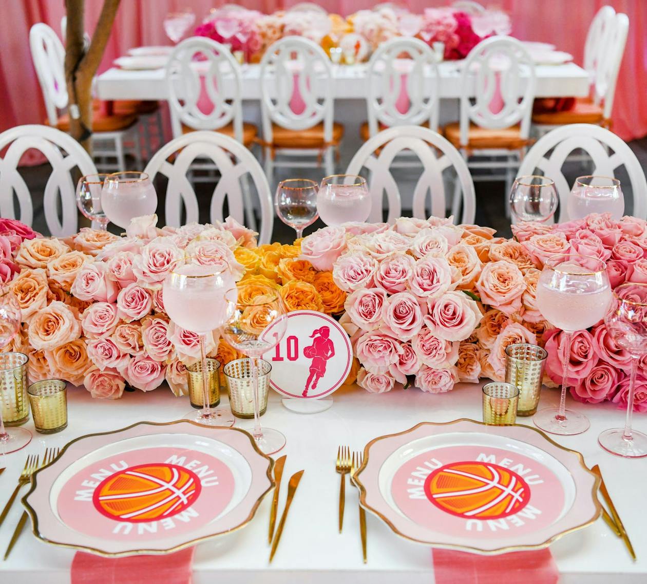 Place Settings and Floral Arrangement on Table at Pink and Gold Basketball Glam Bat Mitzvah | PartySlate