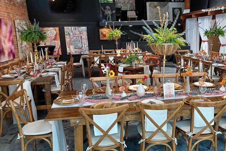 Art Gallery Wedding venue In Houston With Floral Table Scapes and Colorful Art on Walls | PartySlate