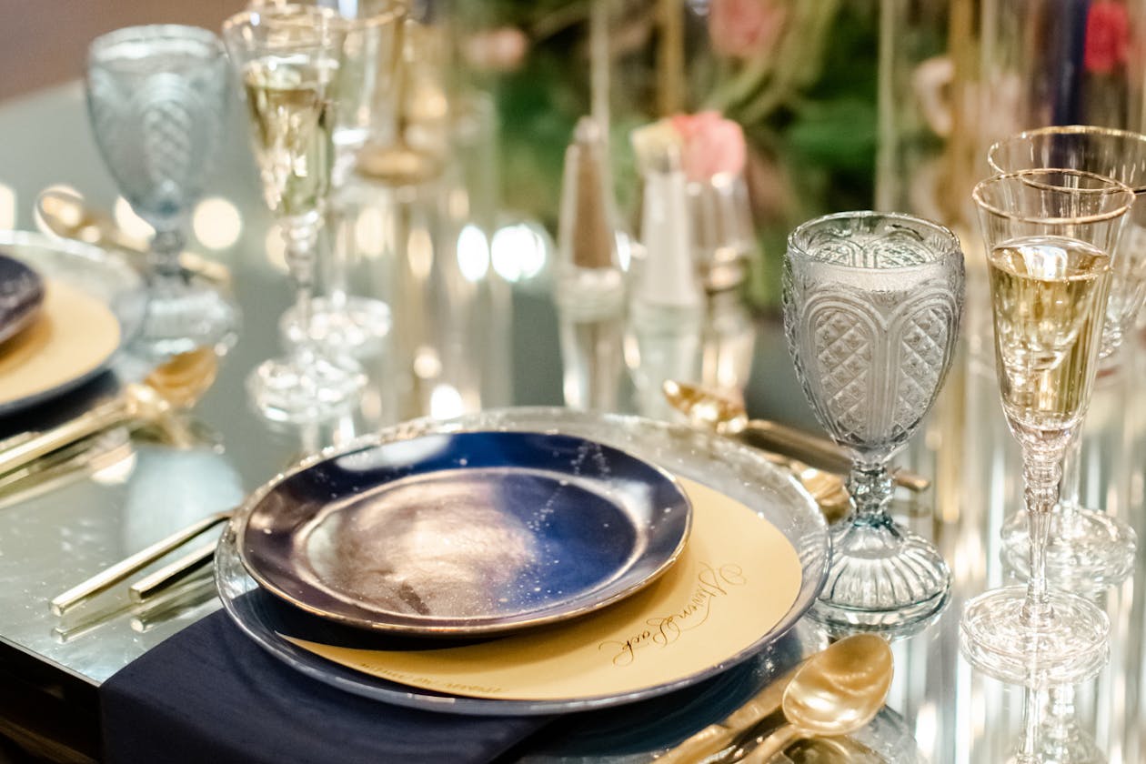 celestial themed wedding with astrological moon and stars place settings on tables | PartySlate