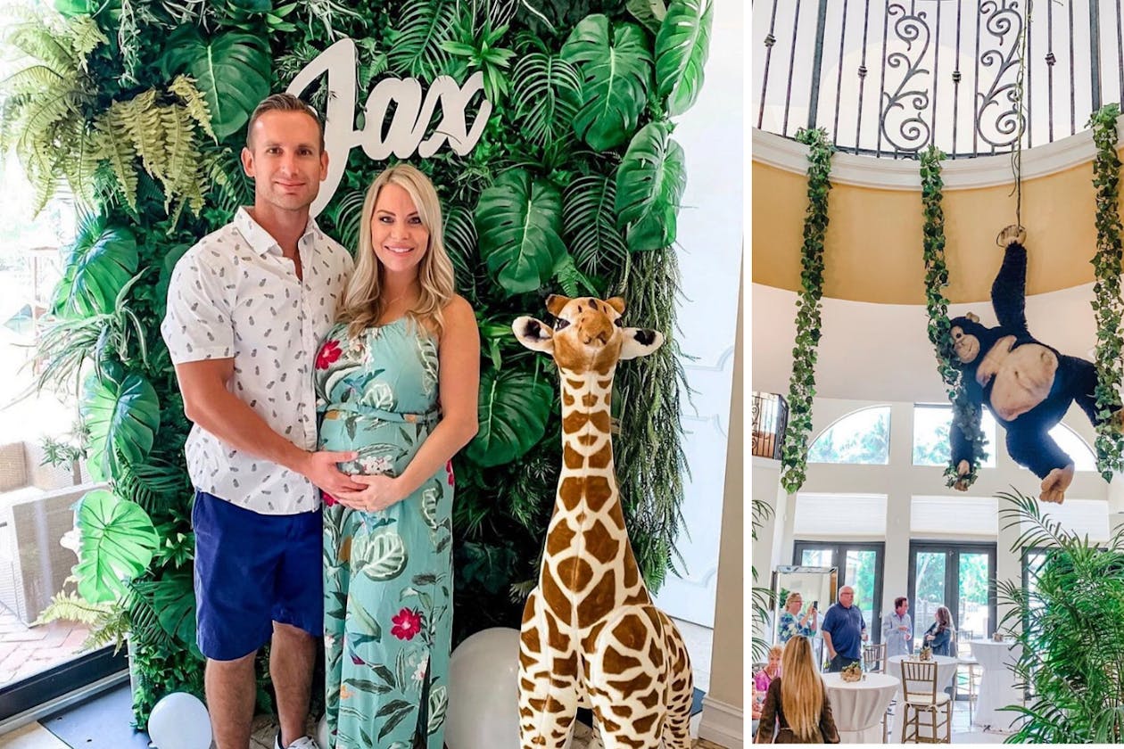 Jungle baby shower with stuffed monkey hanging from vines on railing | PartySlate