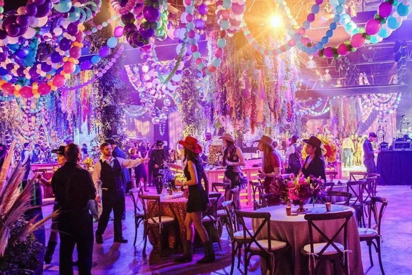 Mardi gras ceiling installation of balloon beads for debutant ball | PartySlate