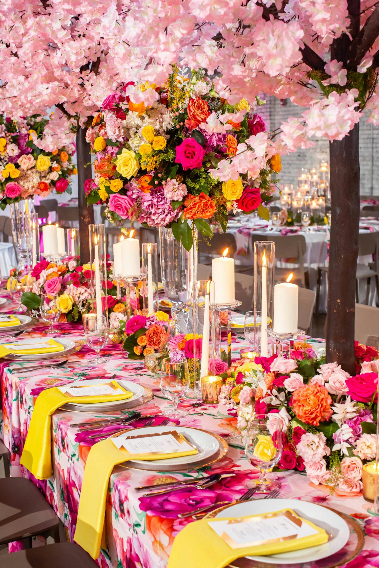 Colorful Wedding With Pink and Orange Floral Centerpieces on Table | PartySlate