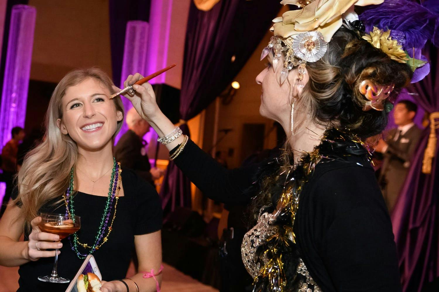 Masked Mardi Gras experiential product launch with live make up artists | PartySlate