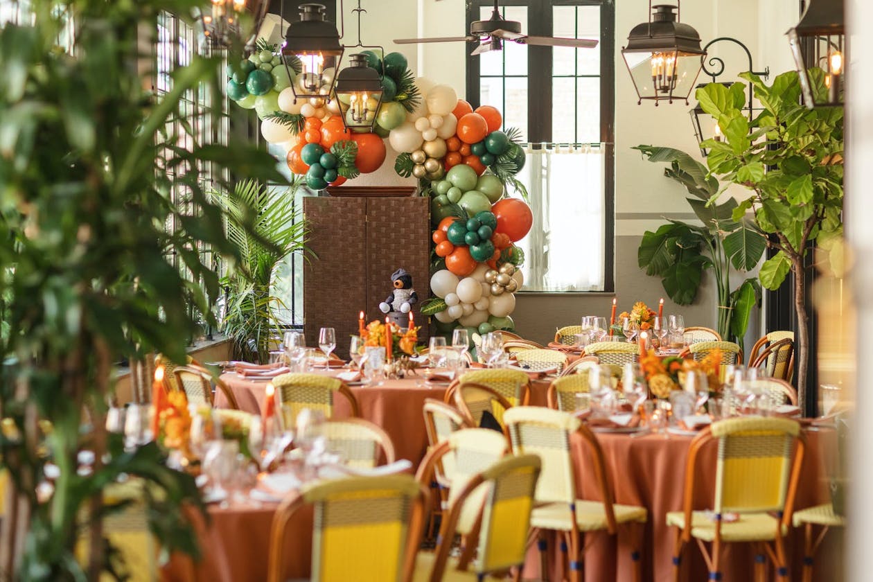 The Jungle Book theme baby shower with green and orange balloons | PartySlate