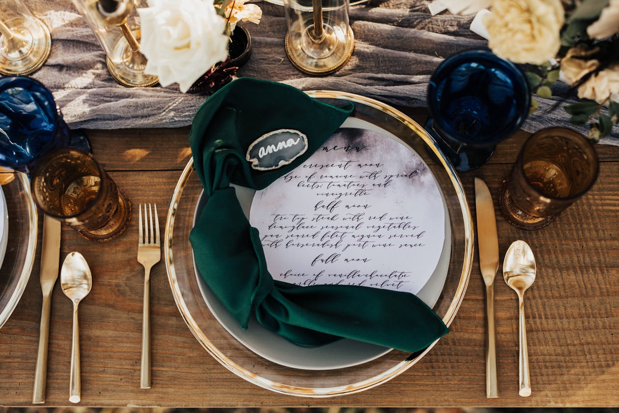 Celestial astrological wedding ceremony with moon shaped place settings on tables | PartySlate
