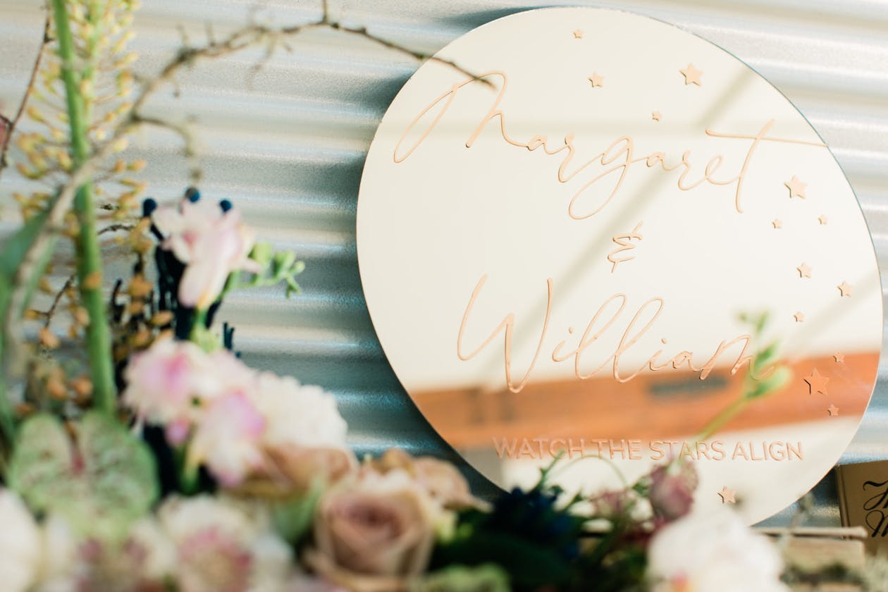Gold Sign at celestial themed wedding welcoming guests | PartySlate