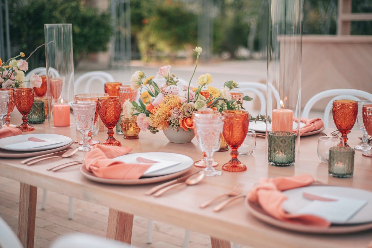 Pink and coral beach wedding tablescape | PartySlate