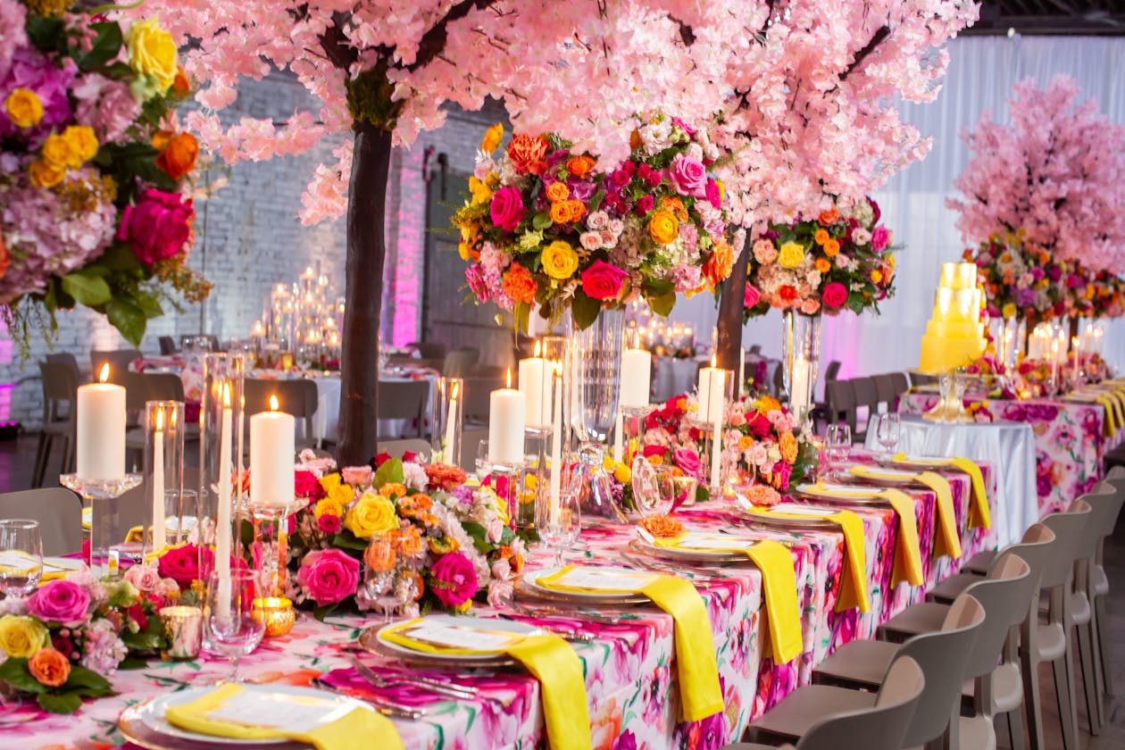 Colorful Wedding With Pink and Orange Floral Centerpieces on Table | PartySlate