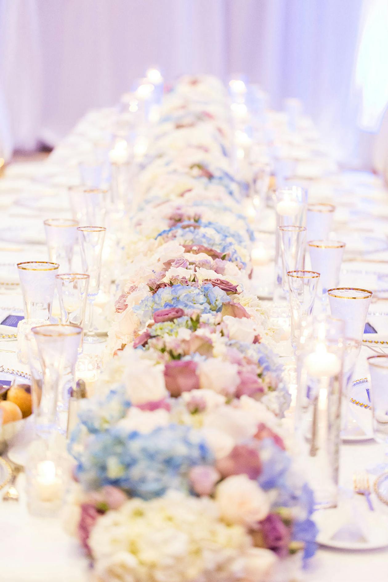 Spring Wedding centerpiece With Blue Florals on Table | PartySlate