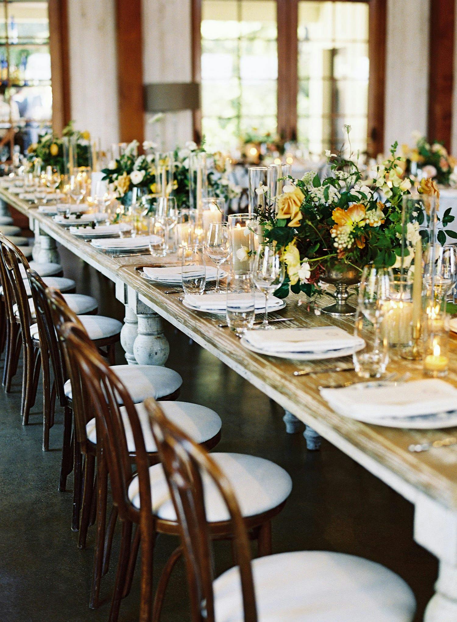 Vintage wedding tablescape with gold flowers | PartySlate