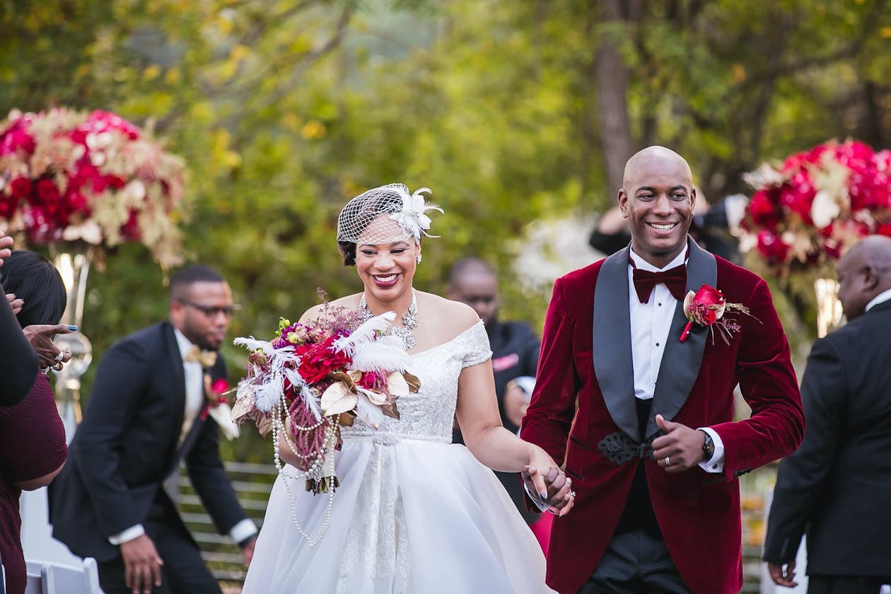 Bride and groom made recessional exit at vintage wedding theme ceremony | PartySlate