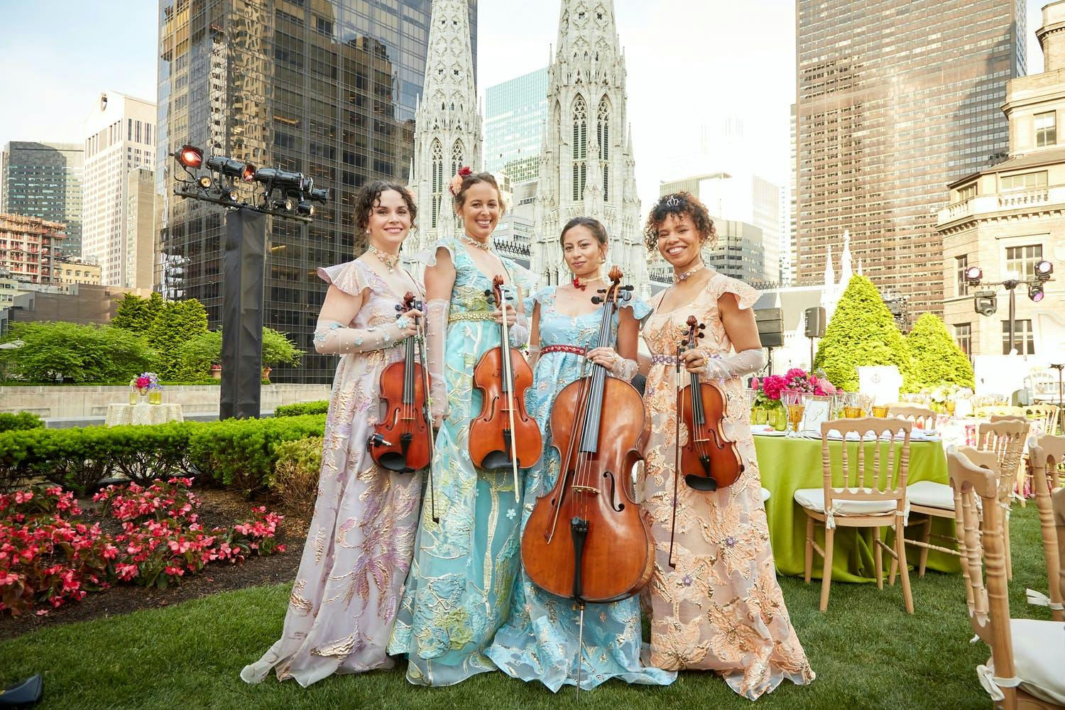 Musicians dressed in luxurious pastels serenaded guests on a manicured rooftop garden overlooking St. Patrick’s Cathedral. | PartySlate