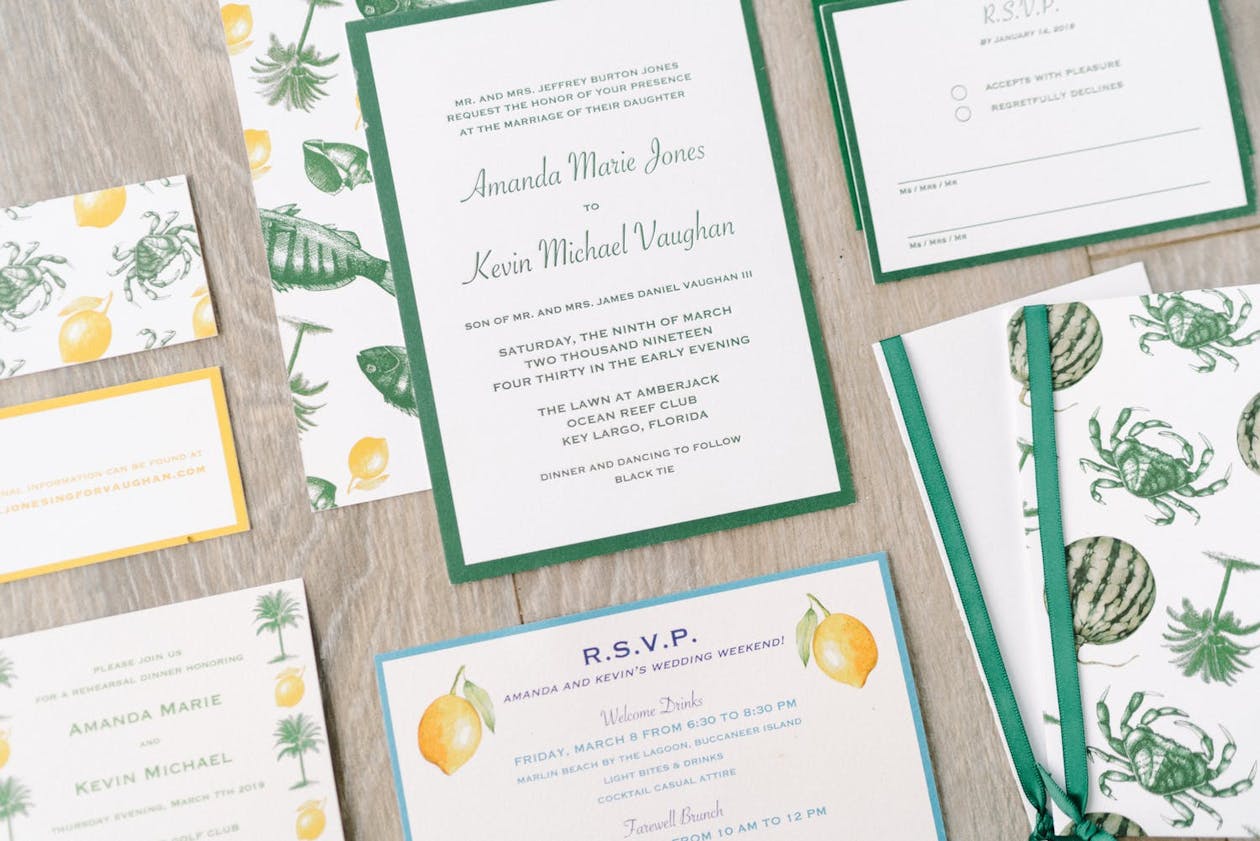 Wedding invitations in green and yellow with crabs and lemon designs | PartySlate