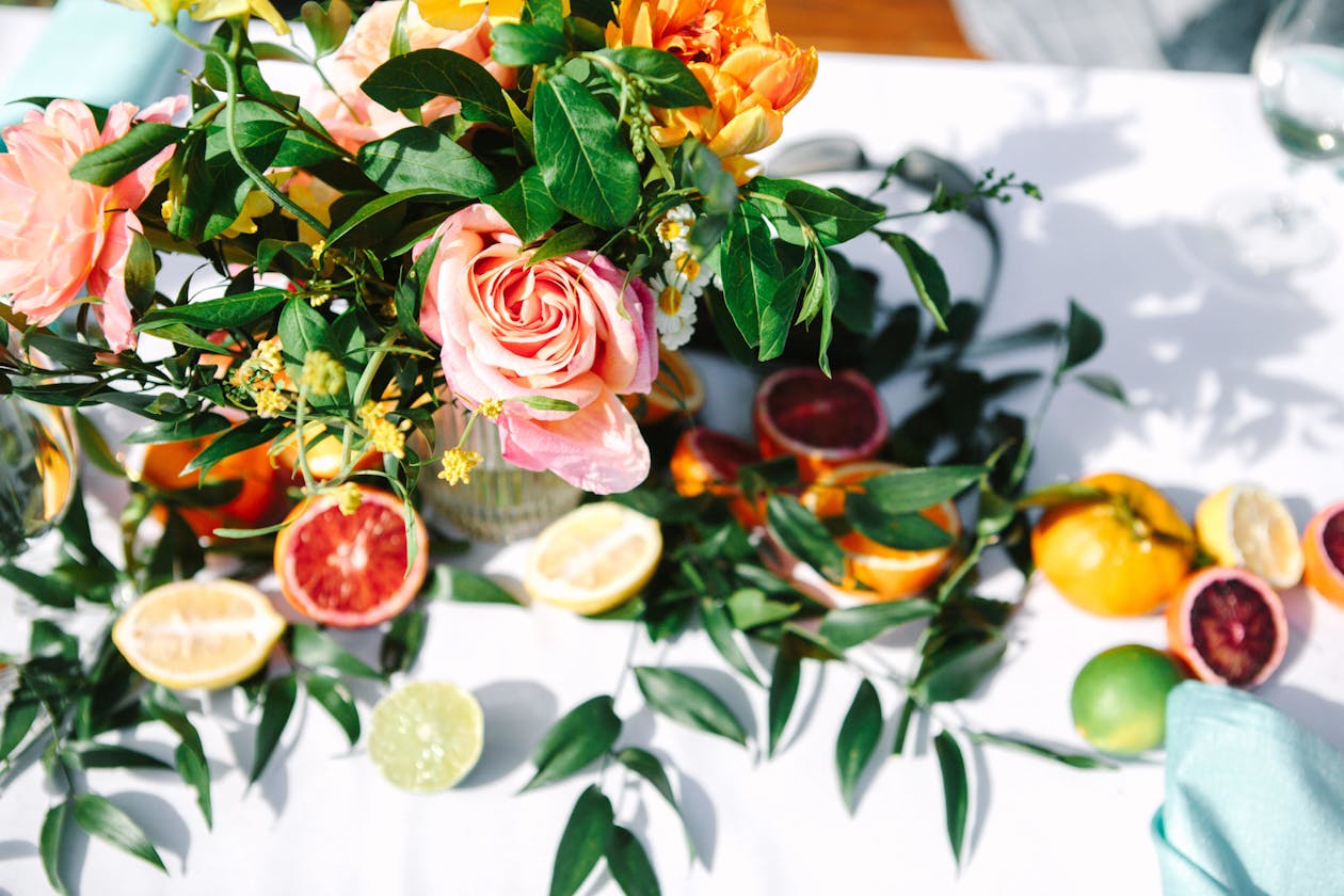 Fresh Spring Centerpiece with Greenery, Fruit, and Florals | PartySlate