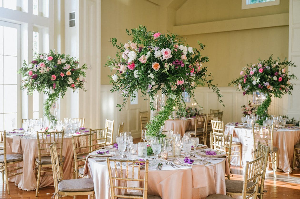 Winding centerpieces with greenery and flowers | PartySlate