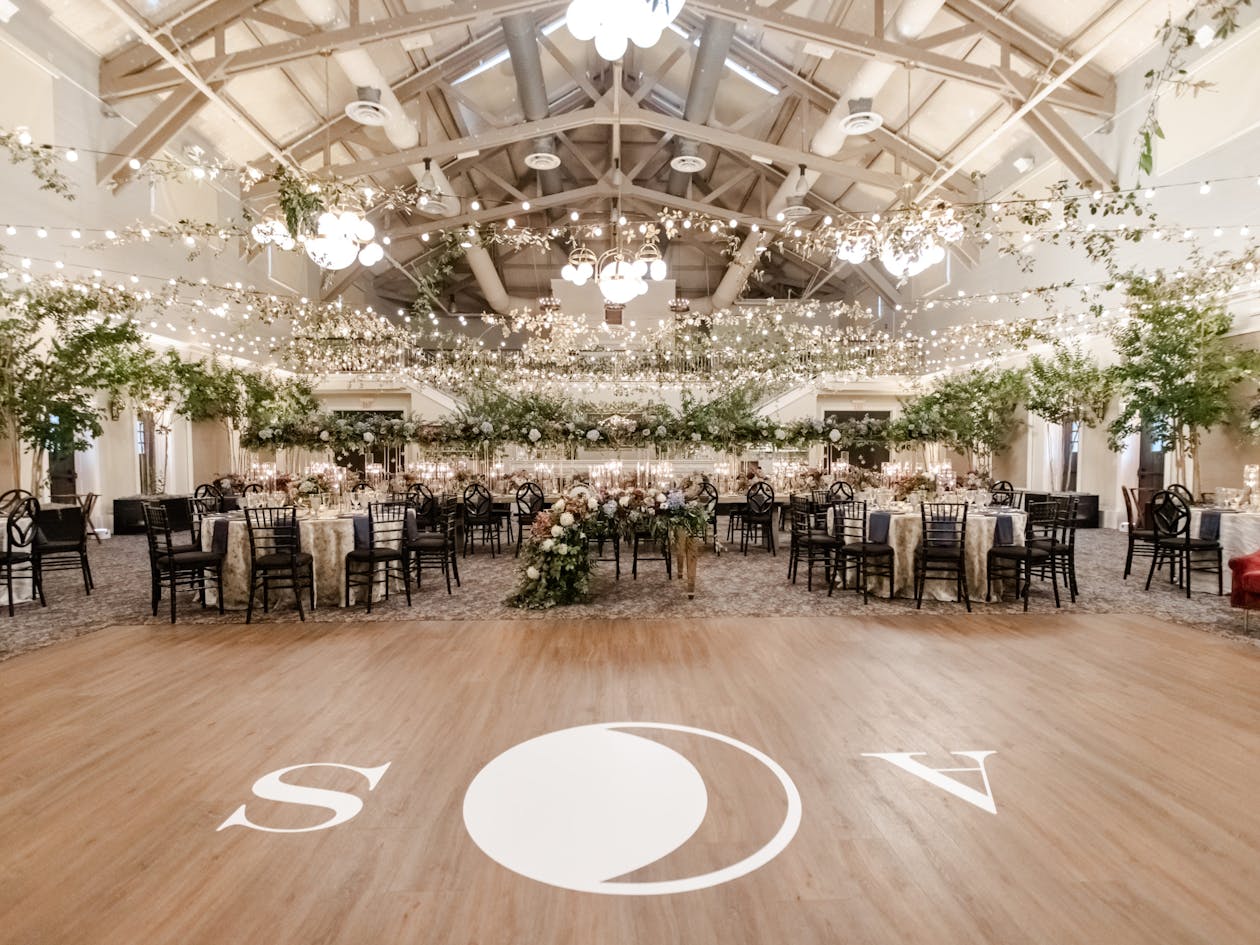 celestial themed wedding dance floor with couples initials and moon | PartySlate