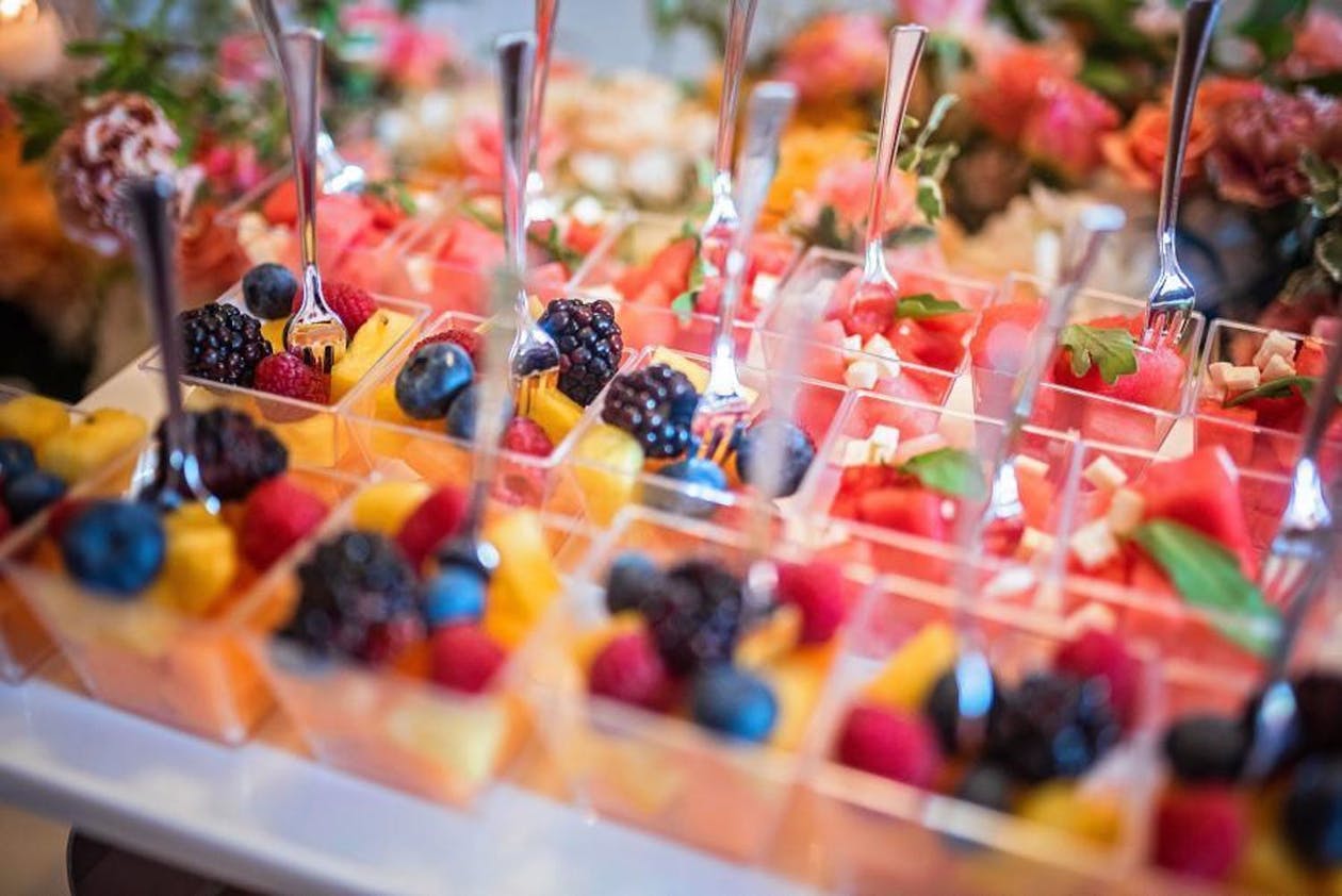 Individual fruit cups in lucite container for baby shower | PartySlate