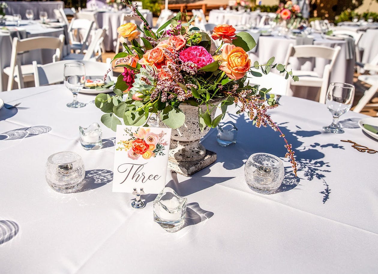 Colorful Centerpiece With Florals in PotOn Tables | PartySlate