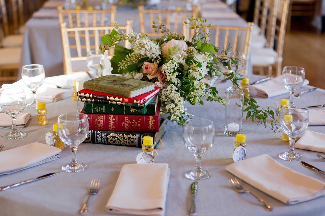 Vintage wedding with novel centerpieces | PartySlate