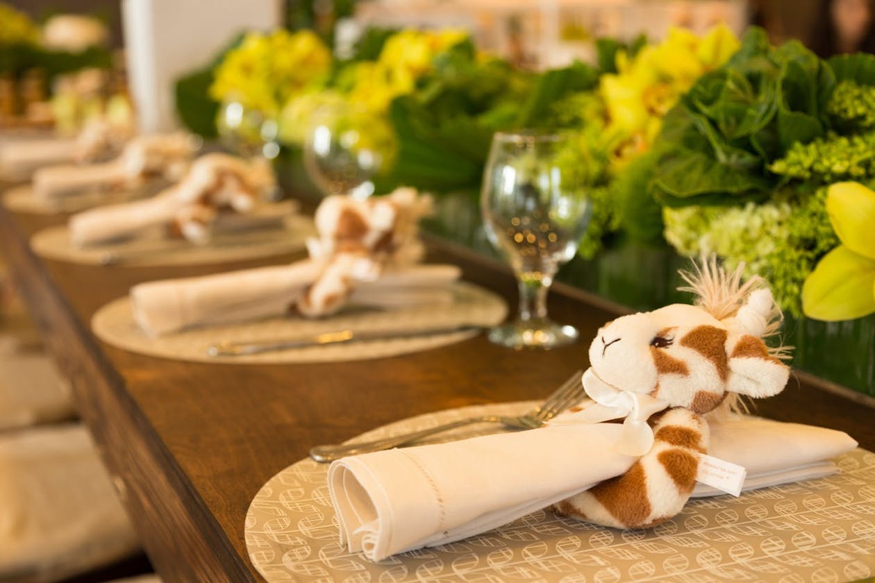 Napkins with fuzzy giraffe napkin holders | PartySlate