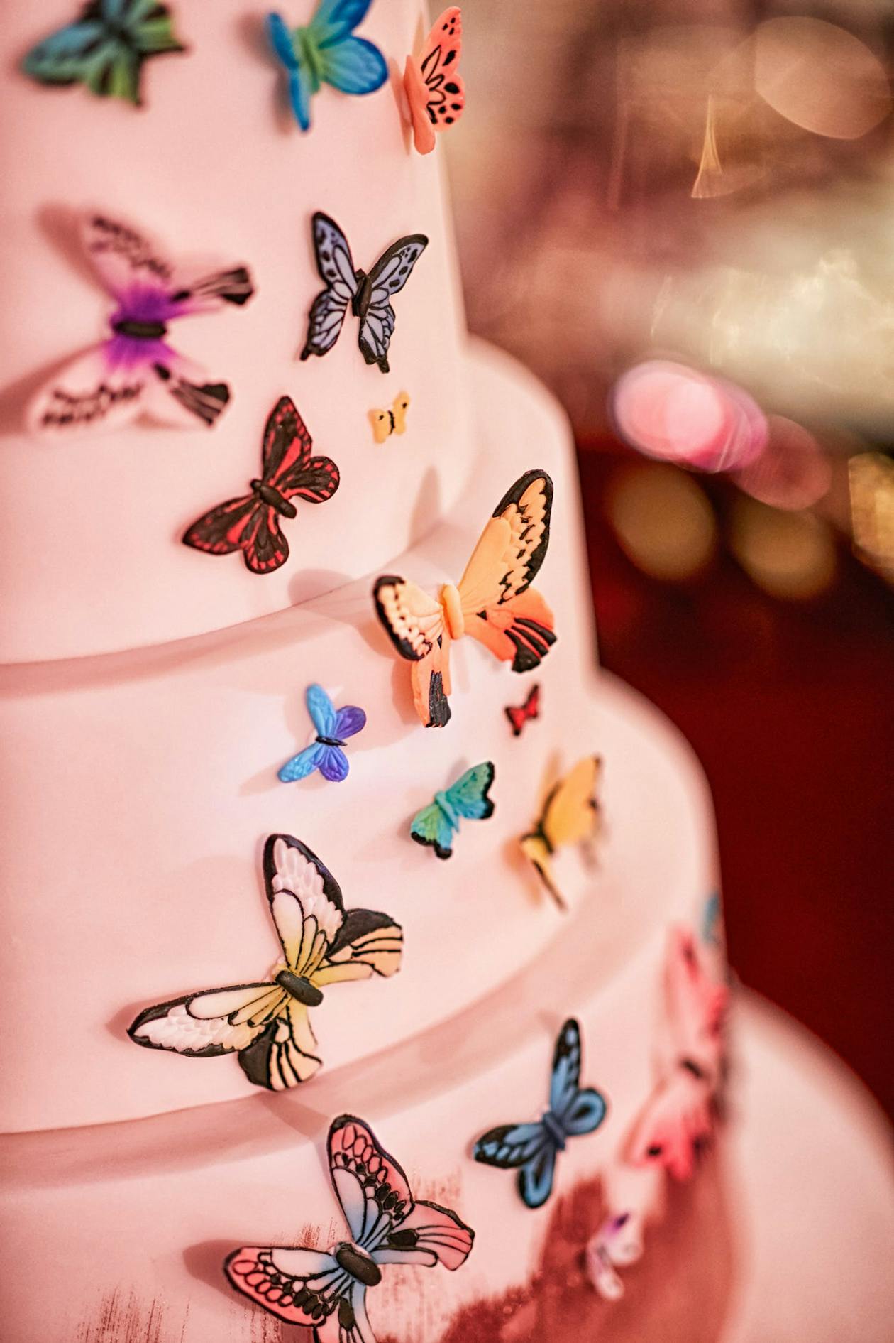 Whimsical wedding cake with butterflies | PartySlate