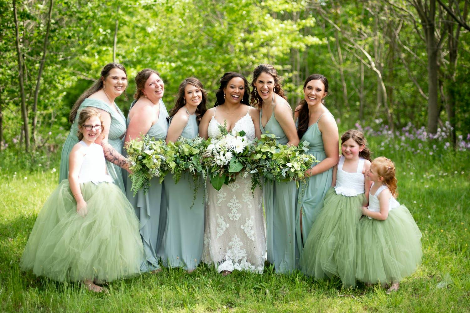 Bridal party in sea foam green and pistachio spring wedding colors | PartySlate