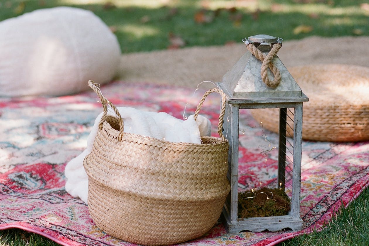 whicker baskets sitting on blanket for a picnic | PartySlate
