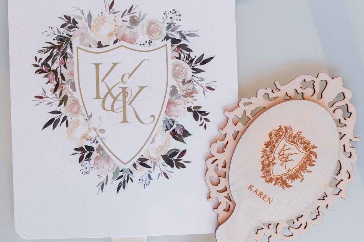 Wedding handheld sings with family crest design | PartySlate