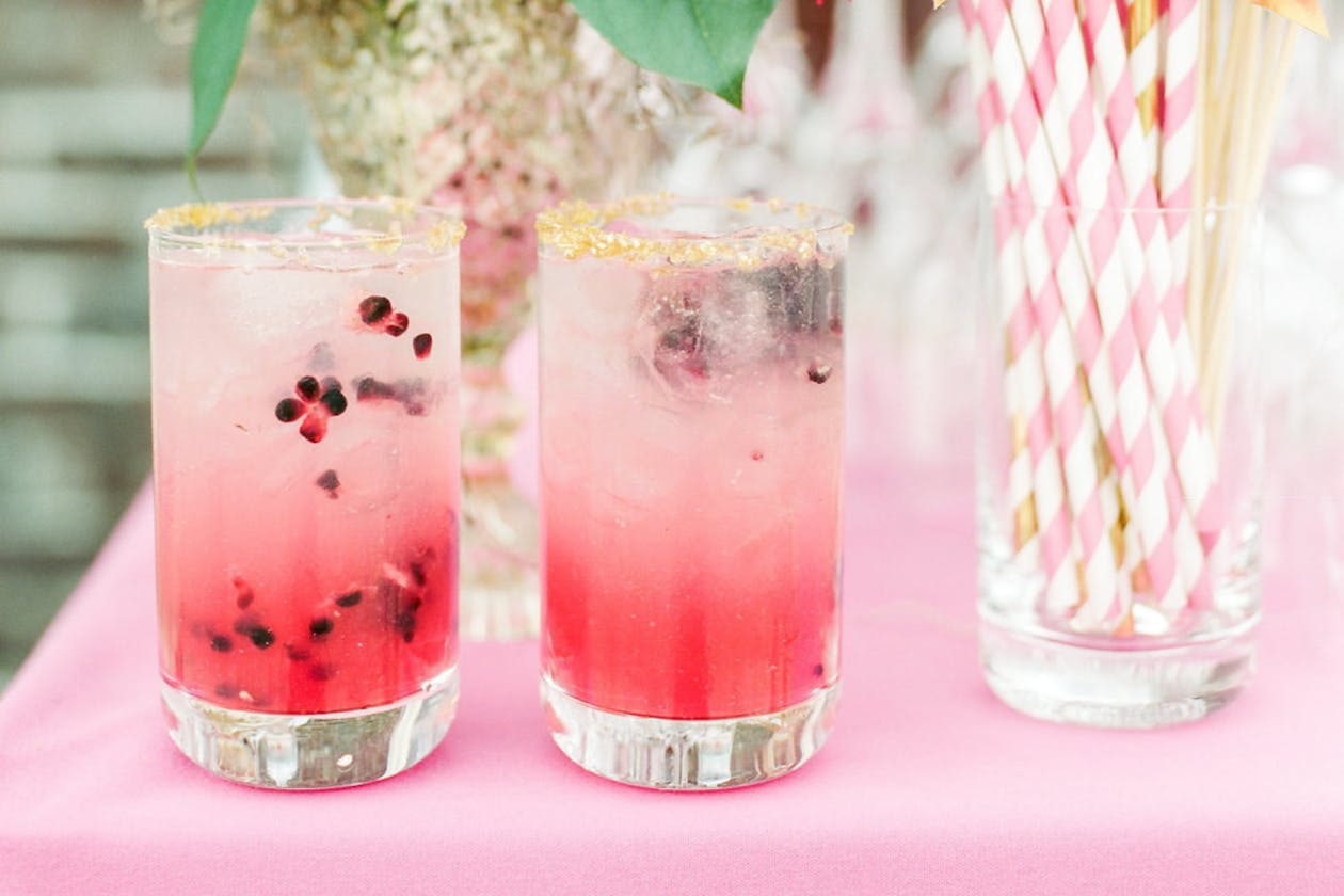 Pink cocktails with black seeds for garden wedding | PartySlate
