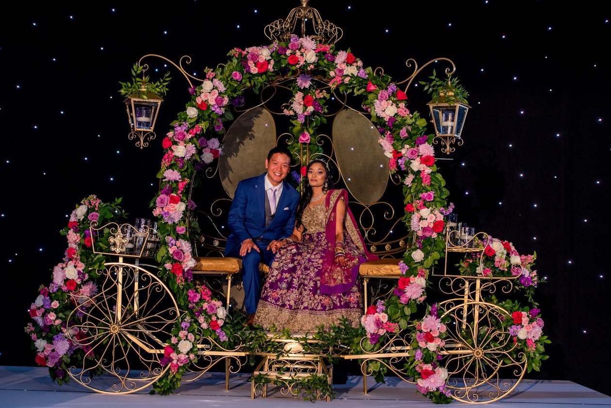 Couple in carriage photo op at South Asian wedding | PartySlate