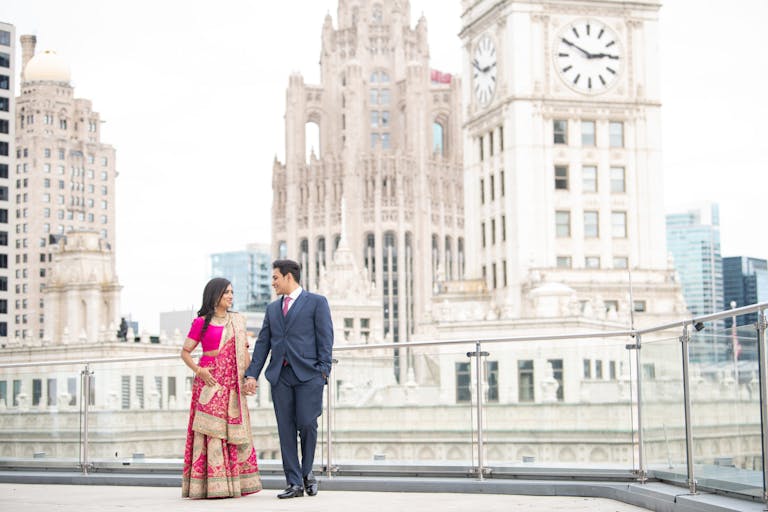 couple walking in wedding attire at outdoor wedding venues in chicago | PartySlate