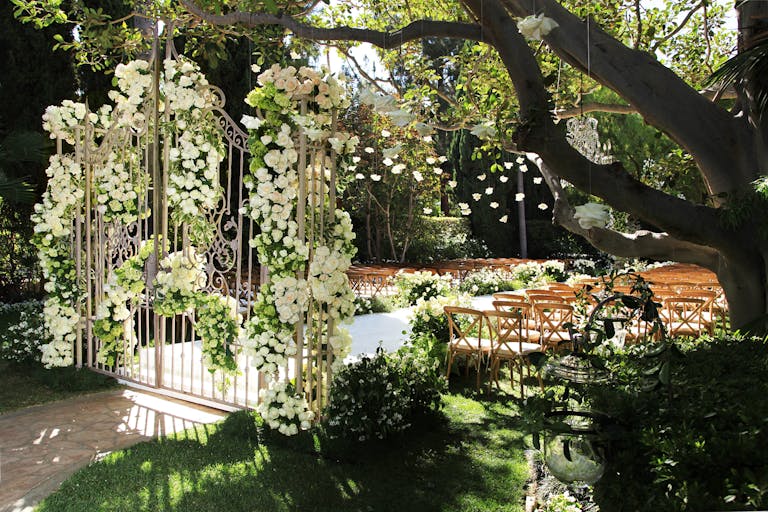 Garden wedding with white flowers and greenery at The Beverly Hills Hotel | PartySlate