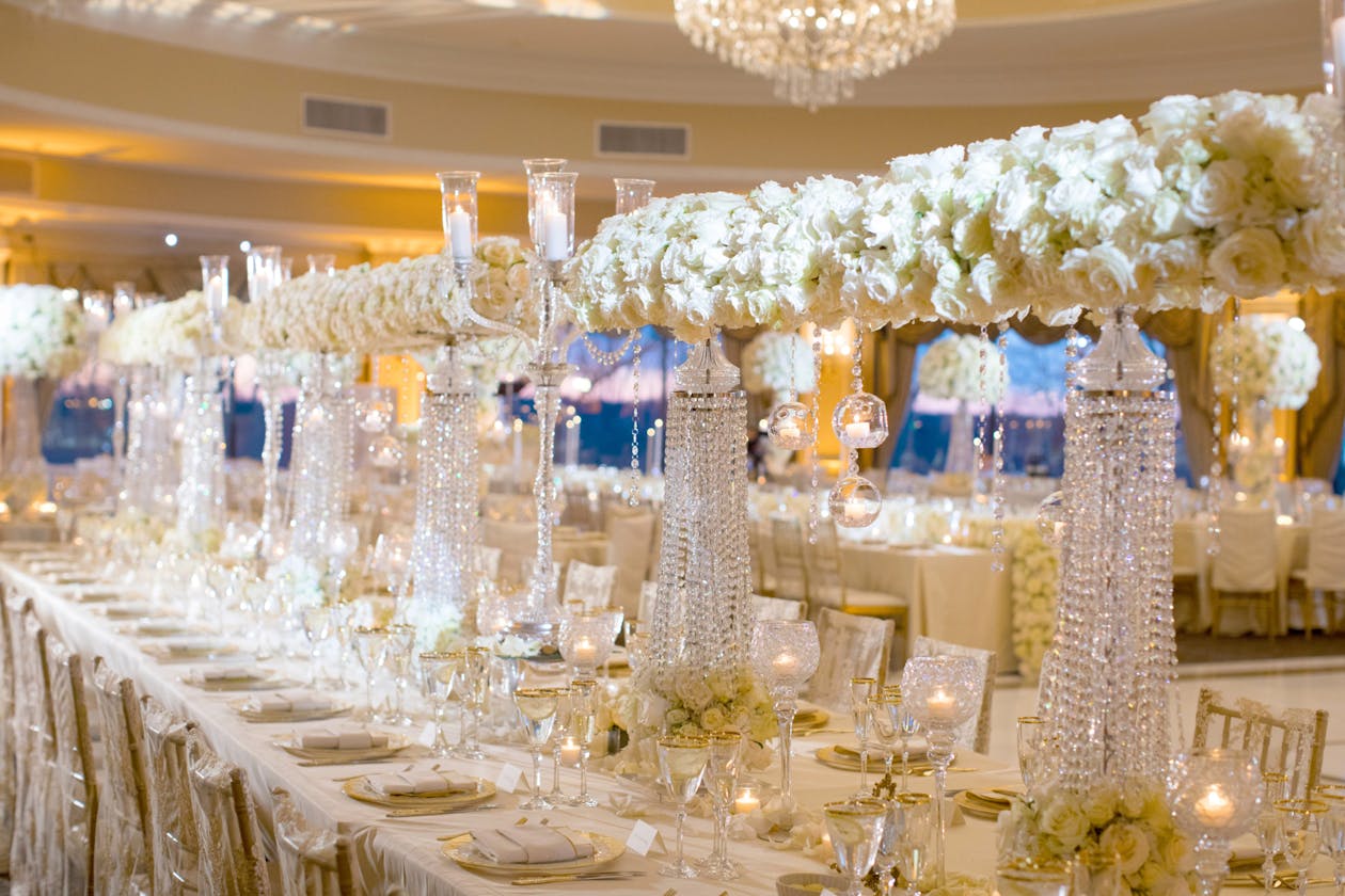 Ballroom wedding with elevated white florals on crystal centerpieces | PartySlate